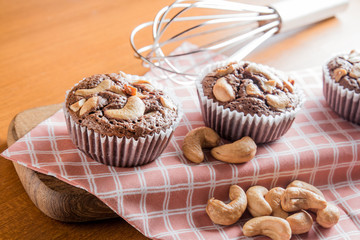 Cup of Brownies With Cashew nuts On Wooden Background