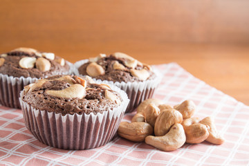 Cup of Brownies With Cashew nuts On Wooden Background