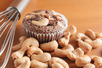 Cup of Brownies With Cashew nuts On Wooden Background