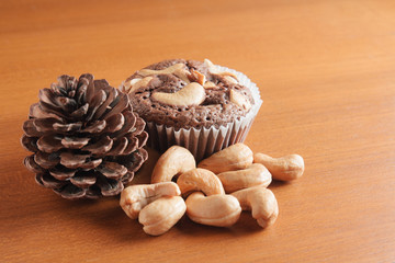 Cup of Brownies With Cashew nuts On Wooden Background