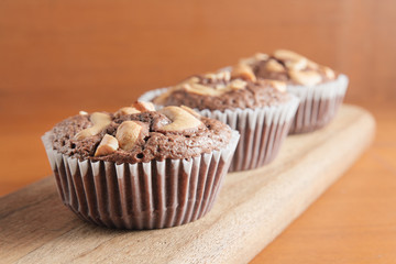 Cup of Brownies With Cashew nuts On Wooden Background