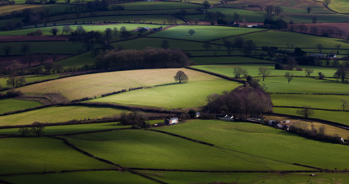 The lush green countryside below the Skirrid and Sugar Loaf mountains in South Wales © leighton collins