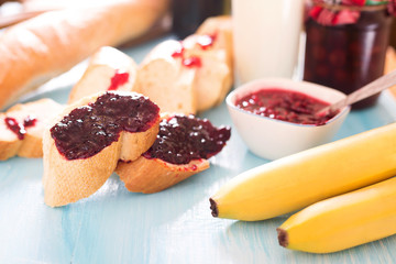 Breakfast baguette with jam and berries