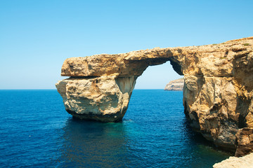 Fototapeta na wymiar Azure Window, famous stone arch of Gozo island in the sun in the