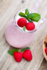 Raspberry milk shake with mint decor.