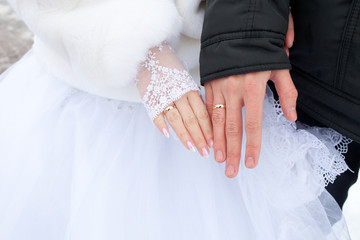 Man and woman hands with wedding rings