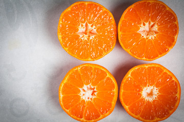 Halved juicy mandarins closeup.