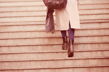 Woman walking up the stairs