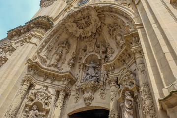 Fototapeta premium Architectural details, sculptures and ornaments of the Basilica of Santa Maria del Coro in San Sebastian (Donostia), Basque Country, Spain