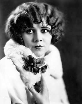 Portrait Of Woman With Flowers On Lapel 