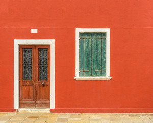 Obraz na płótnie Canvas Entrance of a colorful apartment building in Burano, Venice, Italy.
