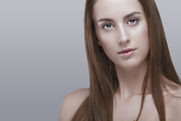 Obraz premium Woman with natural make up on grey background