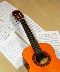 Obraz na płótnie Canvas classical guitar with music score