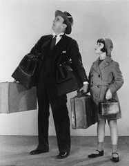 Father and daughter with luggage 