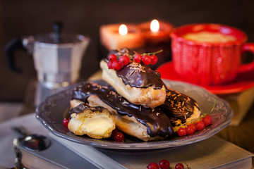 Chocolate eclairs and cup of coffie