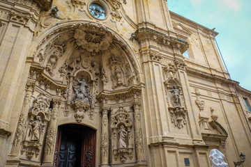 Fototapeta na wymiar Architectural details, sculptures and ornaments of the Basilica of Santa Maria del Coro in San Sebastian (Donostia), Basque Country, Spain