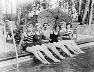 Portrait of female friends at pool  - 104432612
