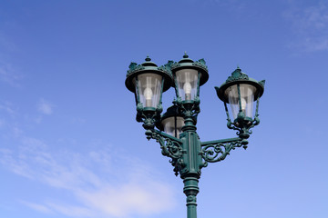 Fototapeta na wymiar old vintage street lamp with blue sky