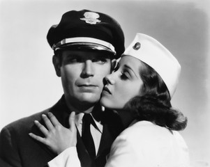 Pilot and stewardess having romantic moment 