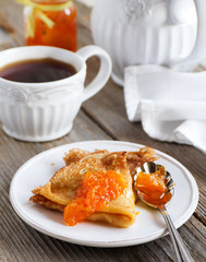 Pancakes with orange marmalade.