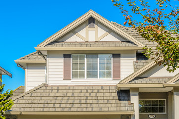 The roof of the house with nice window.