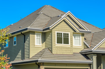 The roof of the house with nice window.