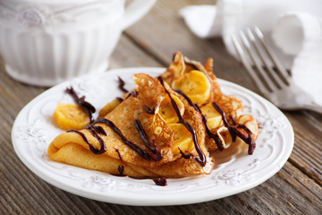 Pancakes with bananas and chocolate.