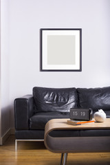 Two black picture frames on wall