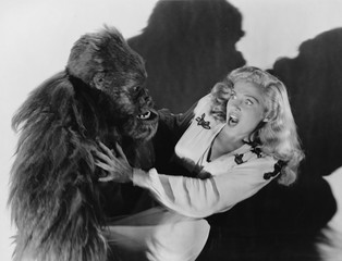 Terrified woman being attacked by gorilla  © everettovrk