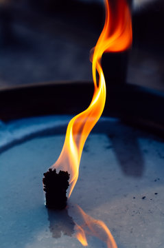 Flame of oil lamp close up horizontal