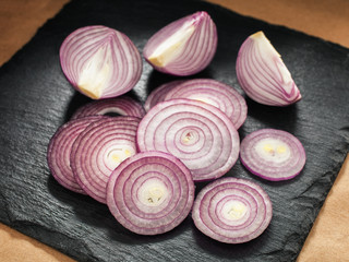 Cut sliked onion on a kitchen board