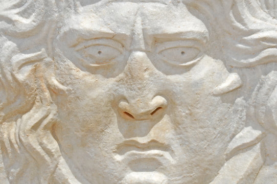 ancient roman sculpture of an angry face