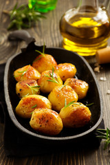 Baked potatoes with rosemary.