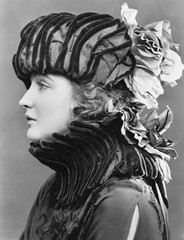 Fototapeta premium Woman wearing elaborate hat 