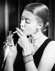 Closeup of woman lighting cigarette 