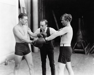 Two boxers and a referee 
