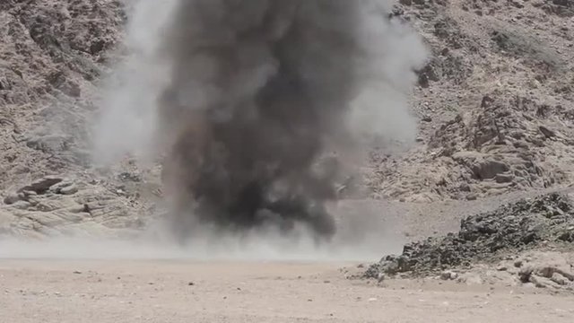 Unused ordnance is exploded in the barren deserts of the Middle East.