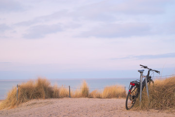 Fototapeta na wymiar Beach of baltic sea with bicycle
