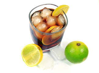 Cocktail with whisky, cola and fresh lime isolated on white background