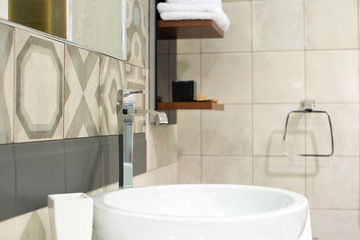 Closeup of washbasin and tap bathroom interior