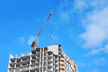 Crane lifting cement mixing container