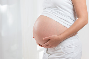 Close-up of pregnant woman tummy