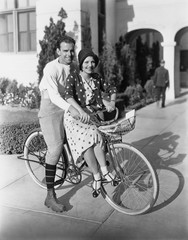 Portrait of couple on bicycle together 