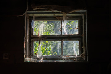 Old window on the soil of the old house