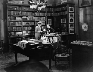 Customer and clerk in book shop 