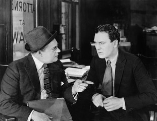 Two businessmen interacting 