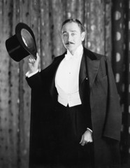 Portrait of a man holding a cylinder 