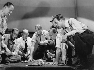 Group of men gambling 