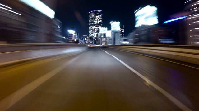 Action hyperlapse POV through the bright neons of metropolitan Tokyo.