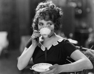 Portrait of woman drinking from teacup  - 104447029